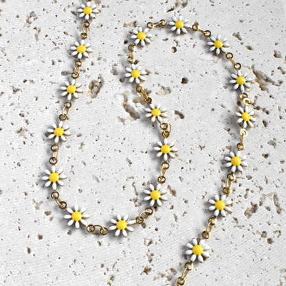 Stainless steel full daisy flower necklace on white stone background - sunmul jewelry