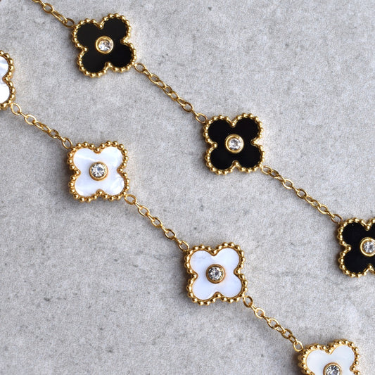 Stainless Steel Classic Flower Cubic Bracelet. Made with high-quality materials, this elegant bracelet adds a touch of sophistication to any outfit. The stunning floral design is sure to turn heads and make a statement.&nbsp;

Material: 316L Stainless Steel, Cubic Zircon, Acrylic
Size: 16cm + 5cm